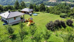 an aerial view of a small house in a field at Vila Mana in Ivanjica