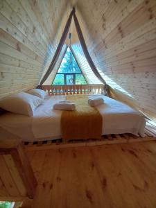 Postel nebo postele na pokoji v ubytování Paradise cottage