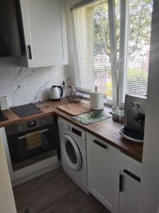 Kuchyň nebo kuchyňský kout v ubytování Apartment Wroblewskiego