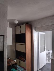 a room with a cupboard and a door to a room at Terasse by the sea in Sutomore