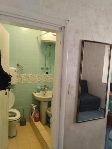 a bathroom with a toilet and a sink at Terasse by the sea in Sutomore