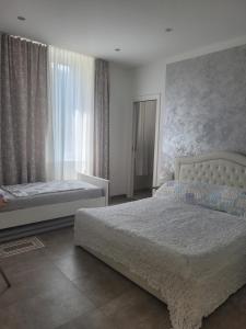 Un pat sau paturi într-o cameră la Apartment Alina