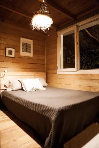 En eller flere senge i et værelse på RuralCaMomo