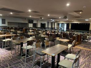 an empty classroom with tables and chairs in a room at Jolly Jacks Static Sanctuary in Heysham
