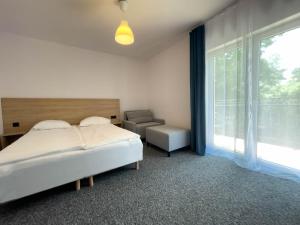 Кровать или кровати в номере Dom Gościnny Amare