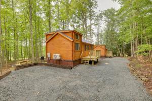 a cabin in the middle of a forest at Stunning Mtn Views Middlebury Center Retreat! in Middlebury Center