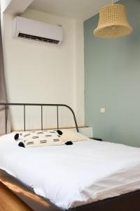 Postel nebo postele na pokoji v ubytování LEVO Urban Studios