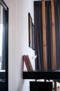 Postel nebo postele na pokoji v ubytování LEVO Urban Studios