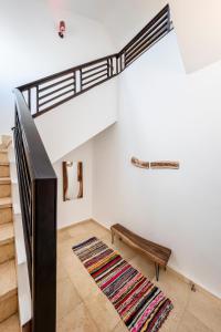 a living room with a loft bed and a rug at Dahab One - El Primo VIP apartments in Dahab +104 photos