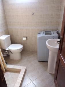 a bathroom with a toilet and a sink in it at Studio in Sharm El Sheikh