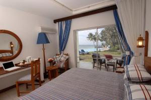 Postel nebo postele na pokoji v ubytování Voyager Beach Resort