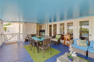 a living room with a table and chairs at Key West Paradise with Private Pool and Ocean View in Cudjoe Key