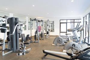 a gym with several treadmills and exercise machines at The Address 2 in Nairobi