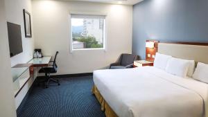 Postel nebo postele na pokoji v ubytování Best Western Santorin