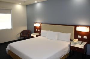 Postel nebo postele na pokoji v ubytování Best Western Santorin