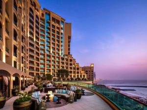 a view of a hotel with a view of the ocean at Fairmont Ajman in Ajman 