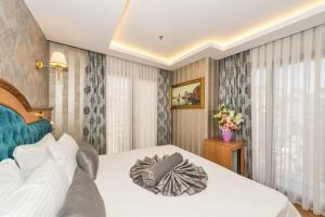 a hotel room with a bed and a window at Aprilis Gold Hotel - Special Category in Istanbul