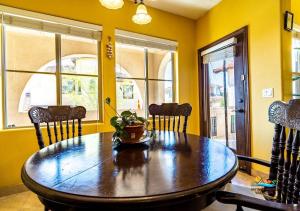 a dining room with a wooden table and chairs at Upscale San Felipe Vacation Villa 41-1 in Playa El Paraíso +25 photos