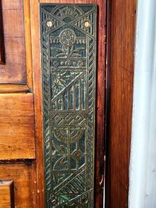 a wooden door with an ornate glass window on it at Cozy Victorian w/4-Car Garage! in Omaha