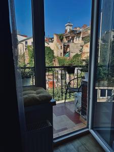 a room with a window with a view of a city at Apart27 in Lviv