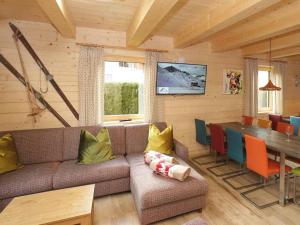 a living room with a couch and a table at Kaprun Lodge - L in Kaprun