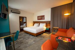 Postel nebo postele na pokoji v ubytování Numi Hotel