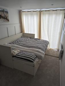 Postel nebo postele na pokoji v ubytování The Cosy Beach