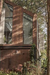 a house with a large window on the side of it at Les Rêveurs Dalat in Xuan An