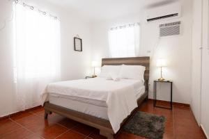 Krevet ili kreveti u jedinici u okviru objekta R&V Combate Beach House 1 with Pool