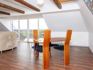 a dining room with a table and chairs at 6 person holiday home in Harboøre-By Traum in Harboør