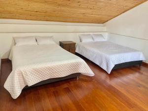 Postel nebo postele na pokoji v ubytování Hospedaje Casa Lola