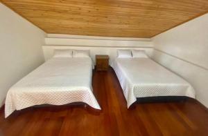 Postel nebo postele na pokoji v ubytování Hospedaje Casa Lola