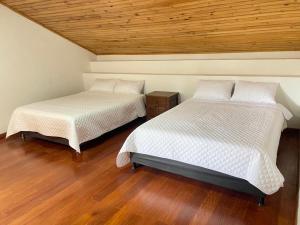 Postel nebo postele na pokoji v ubytování Hospedaje Casa Lola + 20 fotografií