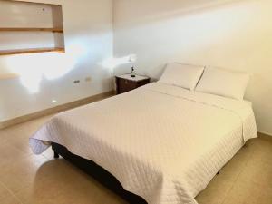 Postel nebo postele na pokoji v ubytování Hospedaje Casa Lola