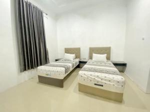 Letto o letti in una camera di villa view2 sayriah