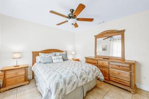 a bedroom with a bed and a ceiling fan at Beautiful Home Away From Home in Royal Palm Beach