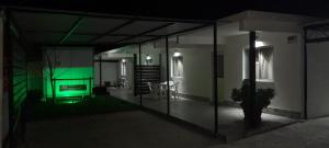 a living room with green lights in a building at Apartamento Familiar Marta in Colonia del Sacramento