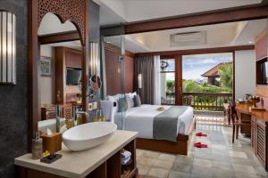 The Alantara Sanur客房内的一张或多张床位
