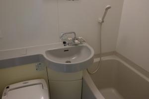 a bathroom with a sink and a toilet at ホテルレジデンス大橋会館 by Re-rent Residence in Tokyo