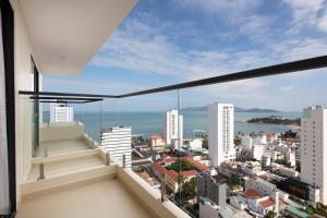 a balcony with a view of the city at Elite Hotel Nha Trang in Nha Trang
