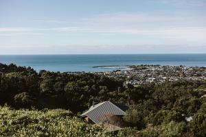 a house on top of a hill near the ocean at Point of View Villas in Apollo Bay