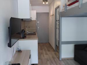 a kitchen with a sink and a counter top at Studio Villard-de-Lans, 1 pièce, 4 personnes - FR-1-689-124 in Villard-de-Lans