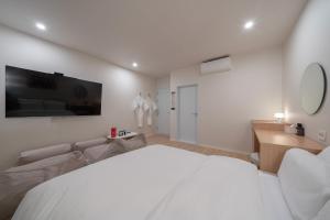 Aank Hotel Ilsan客房内的一张或多张床位