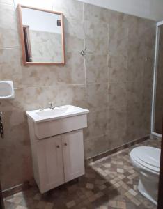 a bathroom with a sink and a toilet at Casa Quinta Los Amigos in Corrientes