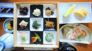 a model of a lunch box with different types of food at Yourou Onsen Honkan in Onomichi