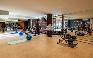 a gym with exercise equipment in a building at Beach View Hotel in Dammam