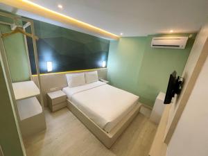 Ліжко або ліжка в номері LEAF HoteL