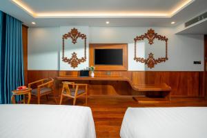TV a/nebo společenská místnost v ubytování Monalisa Luxury Hotel