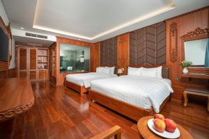 Postel nebo postele na pokoji v ubytování Monalisa Luxury Hotel