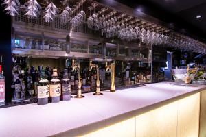 a bar with a lot of bottles of wine at The Vale Niseko in Kutchan